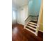 Staircase with hardwood floors and white risers at 1980 Poblado Ct, Kissimmee, FL 34744
