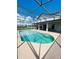 Inviting pool area with screened enclosure, and a spacious patio at 1980 Poblado Ct, Kissimmee, FL 34744