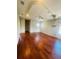 Large bedroom with hardwood floors and ceiling lift at 1980 Poblado Ct, Kissimmee, FL 34744
