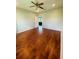 Bright bedroom featuring hardwood floors and access to another room at 1980 Poblado Ct, Kissimmee, FL 34744