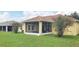 Home with a screened porch, spacious yard, and mature landscaping at 9549 Sw 53Rd Cir, Ocala, FL 34476