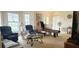 Spacious living room featuring comfortable seating and a unique game table at 9549 Sw 53Rd Cir, Ocala, FL 34476