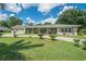 Ranch style home with a spacious driveway at 1500 8Th Se St, Winter Haven, FL 33880