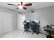 Home office with two computer stations and ceiling fan at 1500 8Th Se St, Winter Haven, FL 33880