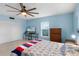 Bedroom with double bed, dresser, and ceiling fan at 1500 8Th Se St, Winter Haven, FL 33880