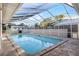 Inviting screened-in pool with surrounding fence at 1500 8Th Se St, Winter Haven, FL 33880