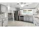 Spacious kitchen, stainless steel appliances, and tile floor at 1500 8Th Se St, Winter Haven, FL 33880