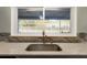 Kitchen sink with granite countertop and view of backyard at 1500 8Th Se St, Winter Haven, FL 33880