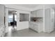Modern kitchen with gray cabinets and granite countertops at 1500 8Th Se St, Winter Haven, FL 33880
