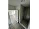 Bathroom with walk-in shower and marble tile at 1339 Tallahassee Ct, Kissimmee, FL 34759