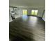 Bright and spacious living area with vinyl flooring and an open floor plan at 1339 Tallahassee Ct, Kissimmee, FL 34759