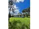 Side view of new construction home with gray siding at 1339 Tallahassee Ct, Kissimmee, FL 34759