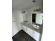 Modern bathroom with dual vanity and grey flooring at 1339 Tallahassee Ct, Kissimmee, FL 34759