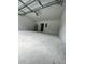Attached garage with automatic opener and concrete floor at 1339 Tallahassee Ct, Kissimmee, FL 34759