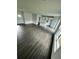 Open living space with gray vinyl plank flooring and kitchen island at 1339 Tallahassee Ct, Kissimmee, FL 34759