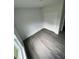 Bright bedroom with grey flooring and double door closet at 1339 Tallahassee Ct, Kissimmee, FL 34759