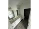 Modern bathroom with double vanity and gray flooring at 1339 Tallahassee Ct, Kissimmee, FL 34759
