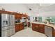 Spacious kitchen with stainless steel appliances and ample counter space at 2771 Cedaridge Cir, Clermont, FL 34711