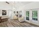Bright sitting area with two armchairs and access to the backyard at 2771 Cedaridge Cir, Clermont, FL 34711