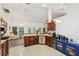 Well-equipped kitchen featuring wood cabinets and stainless steel appliances at 2771 Cedaridge Cir, Clermont, FL 34711