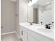 Bright bathroom with double vanity and white cabinets at 4216 Sawtooth Ct, Tavares, FL 32778