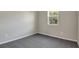 Bright bedroom with gray walls and carpet flooring at 4216 Sawtooth Ct, Tavares, FL 32778