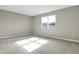 Spacious bedroom with gray walls and carpet flooring at 4216 Sawtooth Ct, Tavares, FL 32778