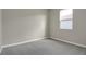 Simple bedroom with gray carpet and neutral walls at 4216 Sawtooth Ct, Tavares, FL 32778
