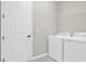 Laundry room with washer, dryer, and overhead shelving at 4216 Sawtooth Ct, Tavares, FL 32778