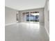 Spacious living area with tile floors and sliding glass doors leading to the backyard at 4216 Sawtooth Ct, Tavares, FL 32778