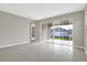 Living room with tile floors and sliding glass doors at 4216 Sawtooth Ct, Tavares, FL 32778