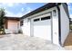 Modern home exterior featuring a white garage door and gray accents at 10633 Watertown Ct, Orlando, FL 32821