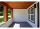 Covered porch with wood accents and a view of the street at 10633 Watertown Ct, Orlando, FL 32821