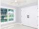 Bright bedroom with large window and double doors at 10633 Watertown Ct, Orlando, FL 32821