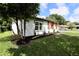 Side view of house showcasing updated exterior and landscaping at 10633 Watertown Ct, Orlando, FL 32821