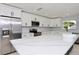 Modern kitchen with stainless steel appliances and large island at 10633 Watertown Ct, Orlando, FL 32821