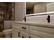 Bathroom with double vanity and large mirror at 10633 Watertown Ct, Orlando, FL 32821