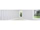 Bedroom with window and accent wall at 10633 Watertown Ct, Orlando, FL 32821