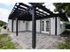 Covered patio with pergola and brick pavers at 10633 Watertown Ct, Orlando, FL 32821