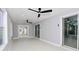 Bright sunroom featuring two ceiling fans and sliding glass doors at 10633 Watertown Ct, Orlando, FL 32821