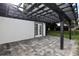 Covered patio with pergola and brick pavers at 10633 Watertown Ct, Orlando, FL 32821