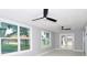 Bright sunroom featuring two ceiling fans and sliding glass doors at 10633 Watertown Ct, Orlando, FL 32821