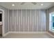 Bedroom with window and accent wall at 10633 Watertown Ct, Orlando, FL 32821