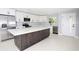 Modern kitchen with stainless steel appliances and large island at 10633 Watertown Ct, Orlando, FL 32821