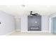 Living room with fireplace, ceiling fan and sliding glass doors at 10633 Watertown Ct, Orlando, FL 32821
