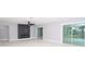 Bright living room with modern fireplace and sliding glass doors at 10633 Watertown Ct, Orlando, FL 32821