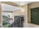 Interior stairwell leading to condo unit with green door at 3301 Whitestone Cir # 308, Kissimmee, FL 34741