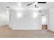 Large living room showcasing neutral walls and tile floors at 3301 Whitestone Cir # 308, Kissimmee, FL 34741