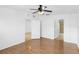 Bright bedroom with ceiling fan, wood floors and en-suite bathroom at 3301 Whitestone Cir # 308, Kissimmee, FL 34741