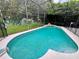 Inviting kidney-shaped pool with a screened enclosure at 2556 Bear Creek Ct, Kissimmee, FL 34747